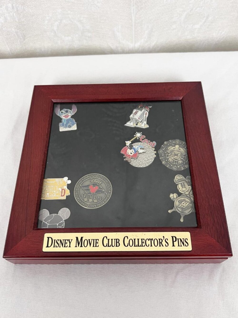 Disney Movie Club wood display case with Disney Parks pins Stitch Epcot Mickey